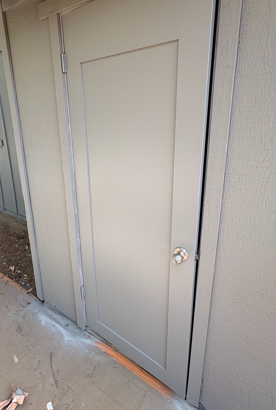 Door replaced and repainted after wood repair